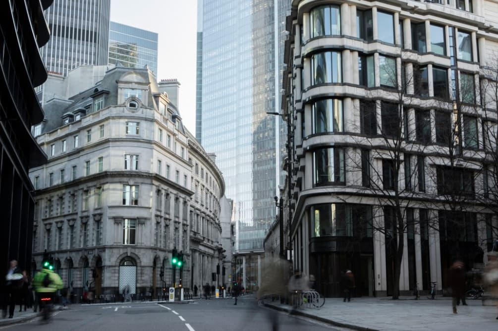 A street view in London showing historic and modern buildings